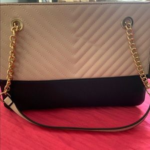 Light pink and black hand bag